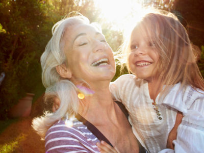 Spry Finance because life is for living - a retired woman holding her grand daughter
