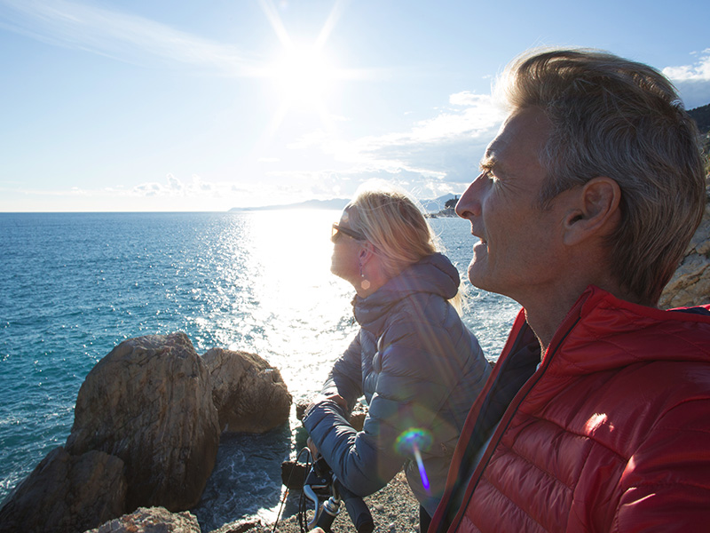 Spry Finance switch to Lifetime Loan - a couple sitting looking out at the sea