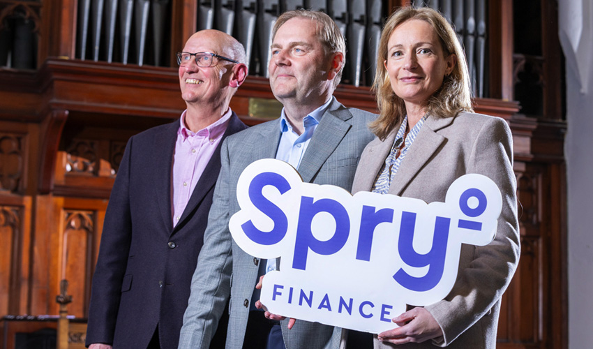 Spry Finance sponsorship of The Guinness Choir - holding logo in front of organ