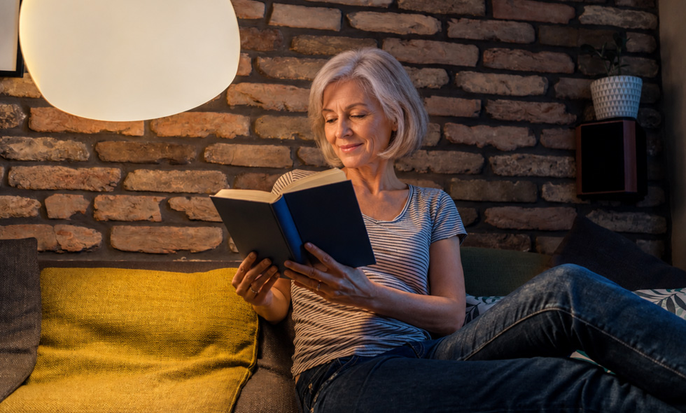 Spry Hub - featured lighting - person reading under a large lamp
